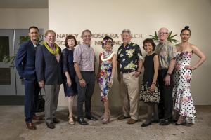 Dr. Nancy Atmospera-Walch with the new signage, her family and UH Mānoa leaders
