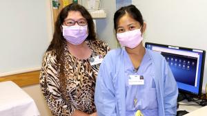 Donna Primiano-Holton, Kuakini Medical Center assistant vice president, and Micah Ellah Rose Eugenio