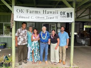Ed Olson, center, met with scholarship recipients Keya Davies and Kassey Hanoa.