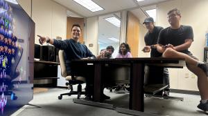 Washington and his research group test out a diagnostic video game. (Photo credit: Anthony Peruma)