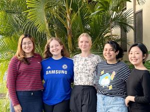 Women of UHE leadership team, including founder Madeline Gilbert (middle)