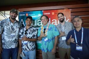 Erik Franklin, director of CliRAIM (center), with a team at the AquaHack event.