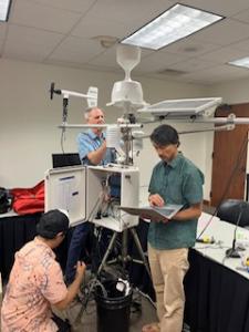 UH researchers with a mesonet station