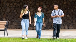 Smiling UH students walking