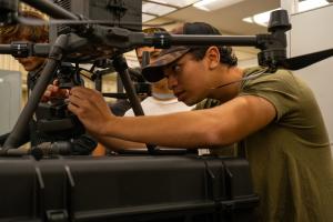 Thomas Costa attaches the LIDAR payload to the DJI Matrice 350 RTK drone. This drone is the workhors