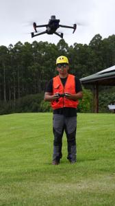 Kahiau Kiyuna, part of the first cohort class in 2023 and a certified commercial drone pilot, hovers