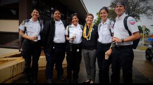 UH President Wendy Hensel (middle) with EMT students