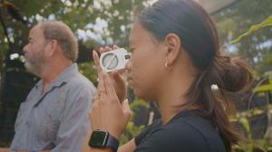 Second-year TEAM student Tiala Kailianu-Carvalho uses a clinometer to measure the height of a tree. 