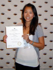 Chapter President Gina Tsui displays the Hui Po’okela chapter’s Silver Torch Award