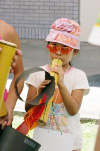 A child enjoys making music at last year's Ka Mole o Na Pua Festival