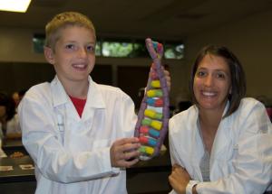 Mother and son proudly show off their DNA model. 