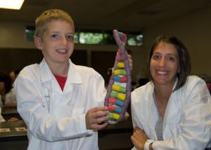 A Saturday Gene-iuses participant creates a model of DNA.