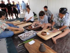 Faculty, staff and students pounding kalo.