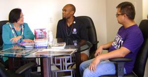 U.S. Senator Mazie Hirono speaks with students Foster Lee Brown, III, and Steven Westerman.