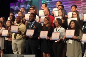 Antallan and Fernandez on stage with other conference award winners.