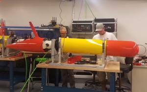 Brett Hobson from MBARI and Gabe Foreman from the University of Hawaii prepare a long-range AUV for field trials. Image: Chris Preston (c) 2018 MBARI.