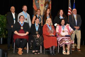 Avis Poai, standing third from left, with other awardees and dignitaries at the ATALM ceremony.
