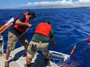 From left, Eric Attias and Jake Perez deploy the system