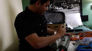 UH Manoa mechanical engineering student Matthew Nakamura works on the Project Imua rocket.