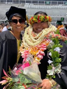 Punihei Lipe and Mahina Flores at UH Mānoa Graduation