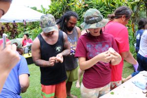 Students sealing their microbe dishes at Kapuna Farms