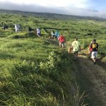 Students walking up a path in Kahikinui, Maui