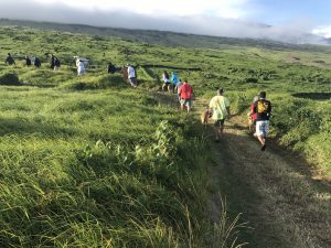 Students walking up a path in Kahikinui, Maui