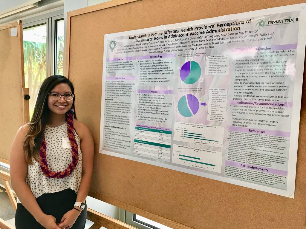 Meliza Roman standing in front of a poster titled "Understanding Factors Affecting Health Providers’ Perceptions of Pharmacist Roles in HPV Vaccine Administration"