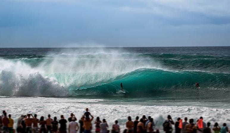 <p>Fig. 6. A surfer catches a wave at the Banzai Pipeline on the North Shore of Oʻahu.</p>