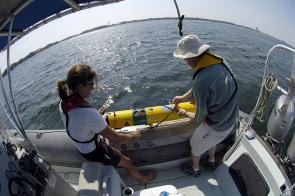 <p>Fig. 1. Ocean engineers Amy Kukulya and Tom Austin prepare to launch an Autonomous Underwater Vehicle (AUV), which conducts rapid environmental surveys and can detect underwater mines.</p><br />
