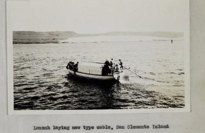 <p>Fig. 3. A boat launches the laying of the cable from hydrophone to the shore station for radio acoustic ranging operations.</p>