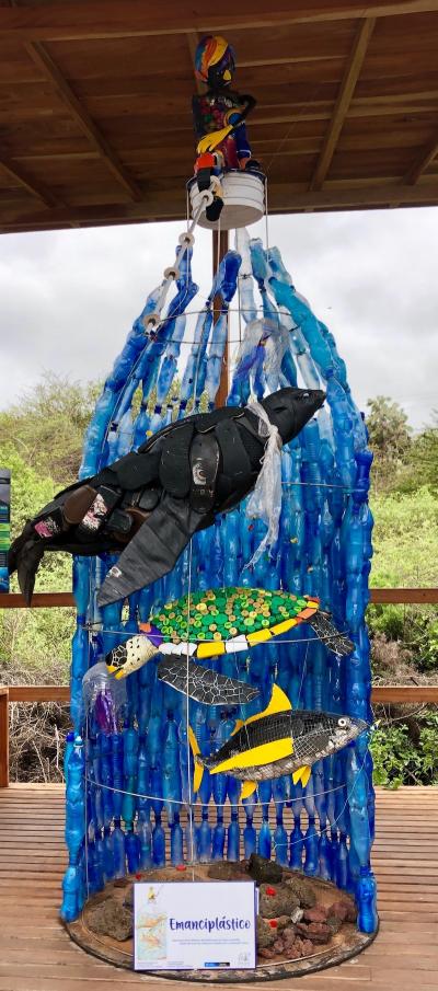 <p>Fig. 2. The sculpture entitled "Emanciplástico" stands over 10 feet tall at the Charles Darwin Research enter on the island of Santa Cruz in the Galapagos. The title represents a need for freedom from plastic and is made from plastic materials collected on the shores of the Galapagos Islands.&nbsp;</p><p>To learn more about their process in this project, check out the <a data-cke-saved-href="https://www.darwinfoundation.org/en/blog-articles/430-changing-attitudes-towards-plastic-pollution-through-art" href="https://www.darwinfoundation.org/en/blog-articles/430-changing-attitudes-towards-plastic-pollution-through-art">DarwinFoundation.org</a></p>