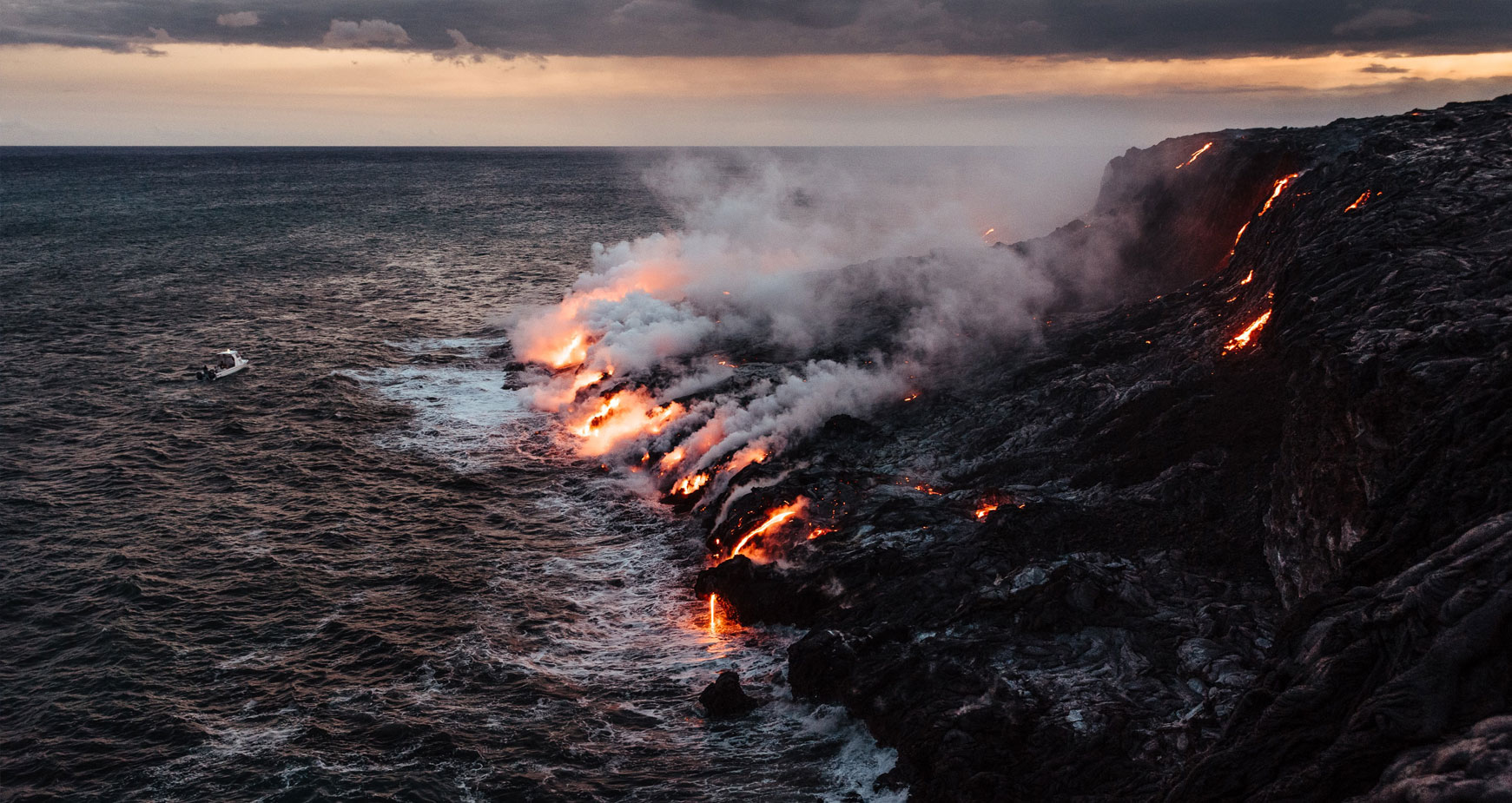 volcano flowing lava into ocean