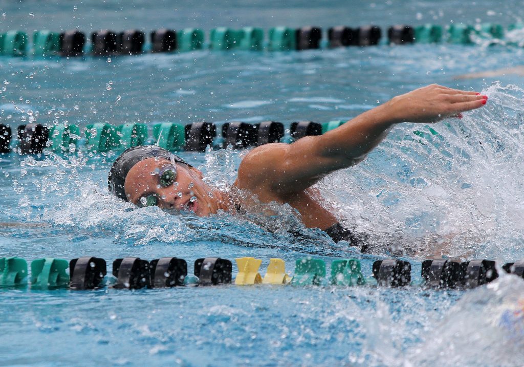 University of Hawaii at Manoa Women's Swimming Player Swimming a Lap