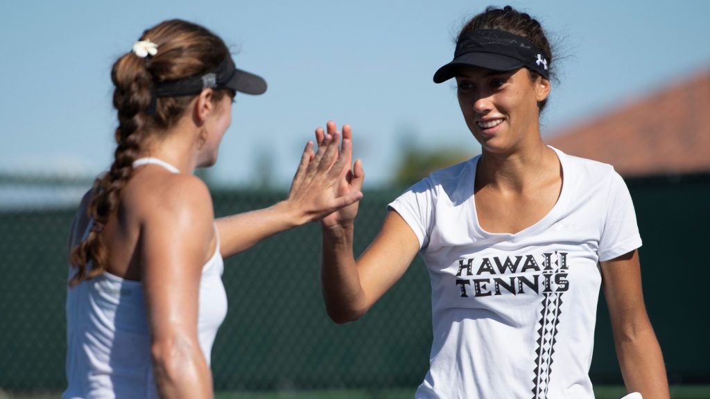 University of Hawaii at Manoa Women's Tennis team High-Fiving eachother