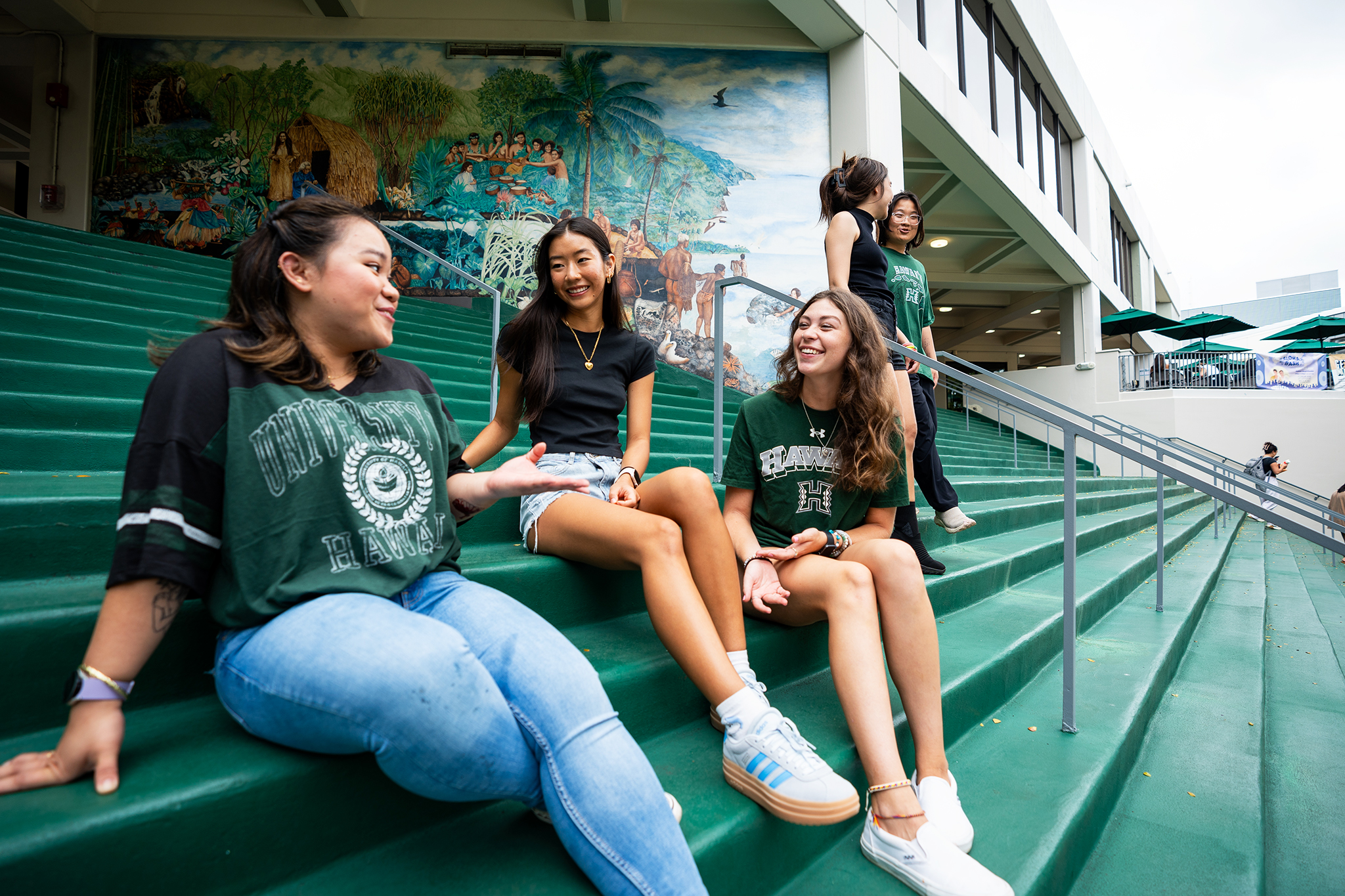 students sitting on the steps of campus center