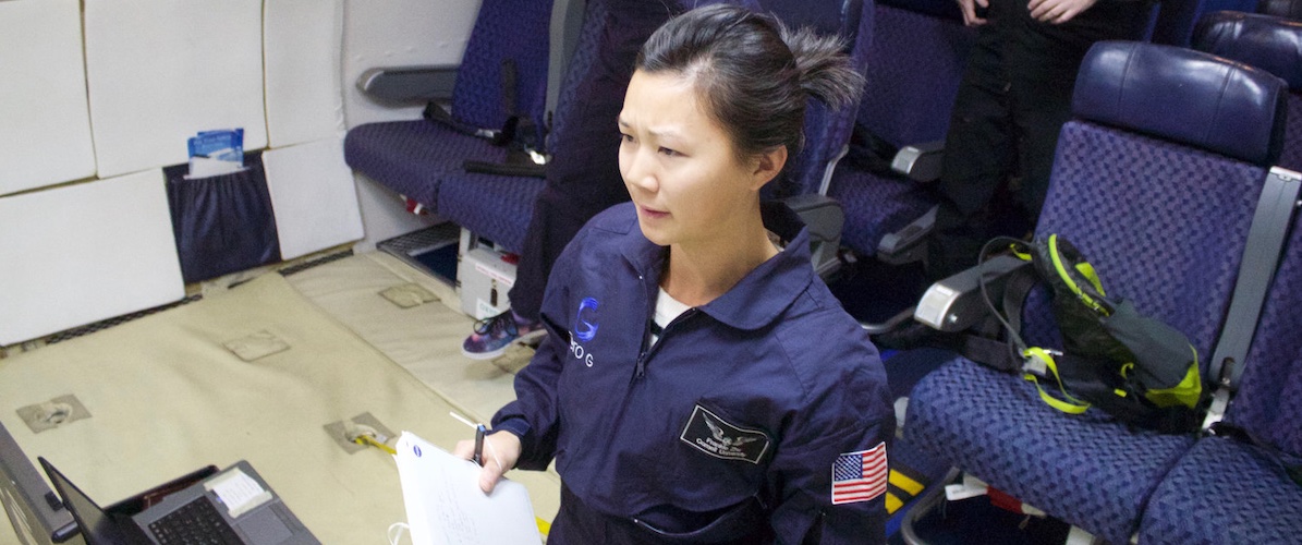 Dr. Frankie Zhu observing and taking notes during microgravity experiment, as seen in NASA press release.