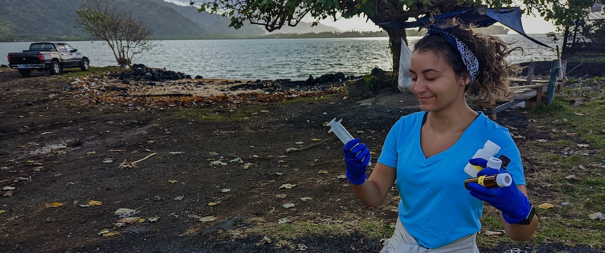 Hailey Pantaleo collects water quality samples during field work in American Sāmoa in August, 2022.