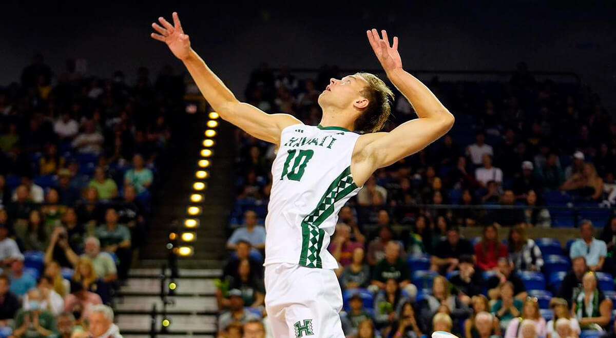 UH Men's volleyball player about to spike the ball