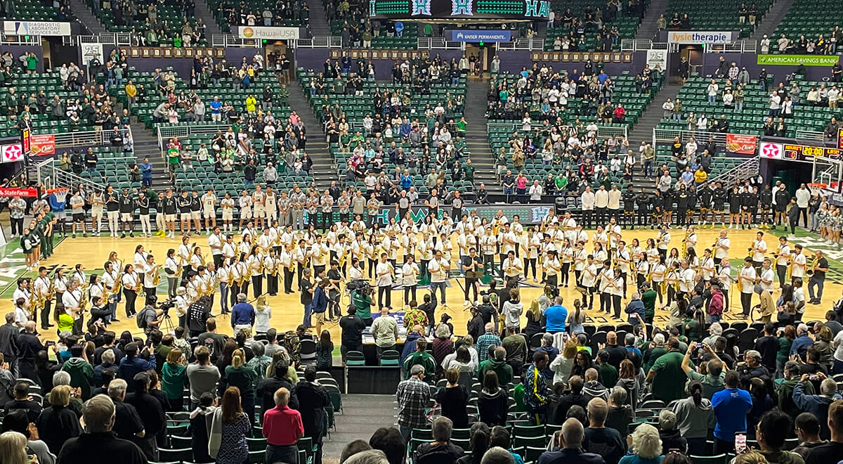 More than 100 members of the the UH Band attempt a world record by simultaneously playing their saxophones on the SimpliFi Arena at the Stan Sheriff Center's basketball court