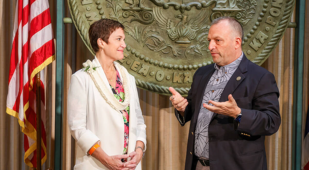 Incoming UH President Wendy Hensel and Hawaii Governor Josh Green stand together